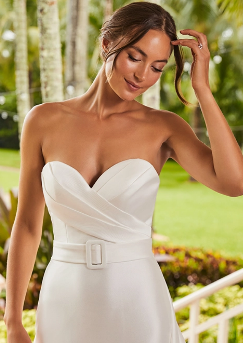 Model wearing white Adriana Papell dress