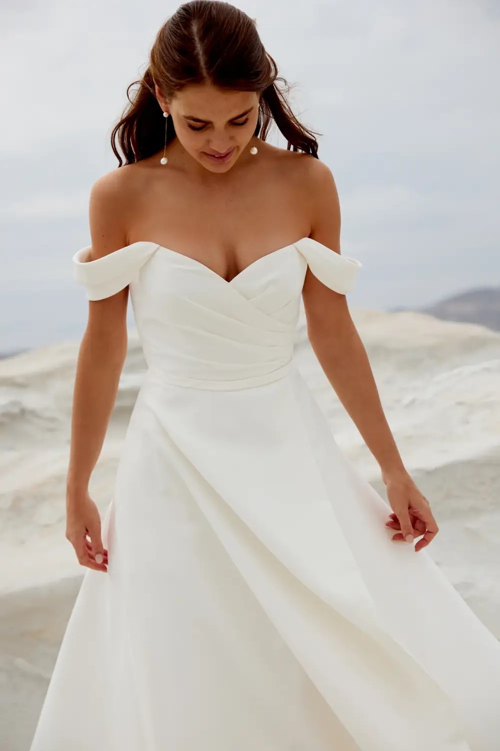 Model wearing white Adore by JA dress