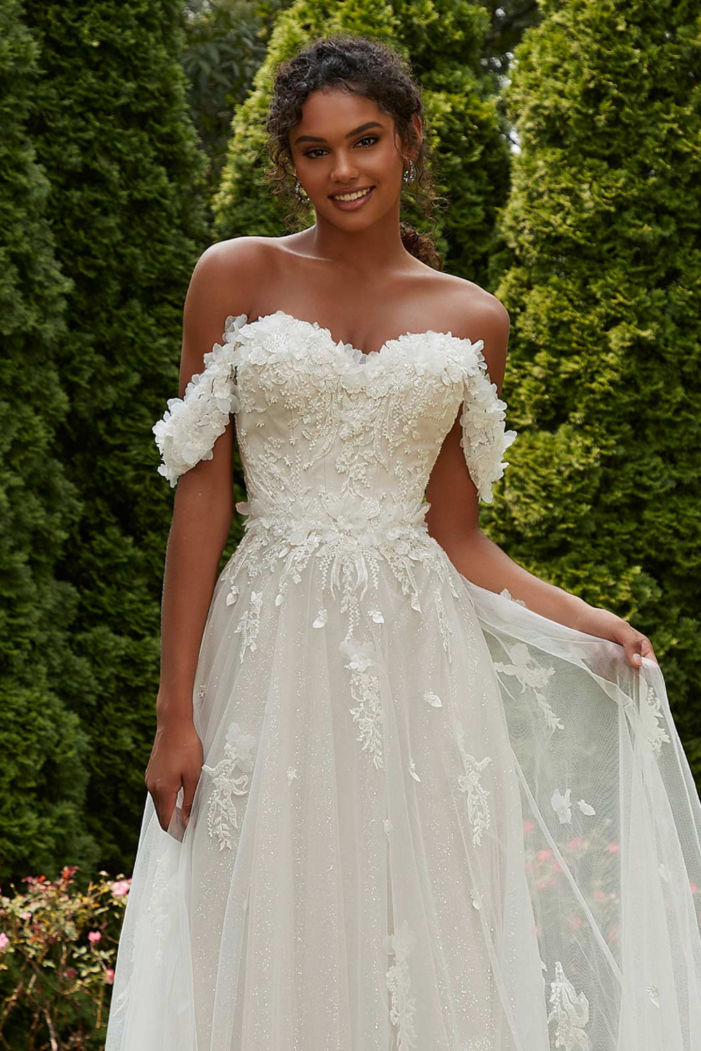 Model wearing white Morilee dress