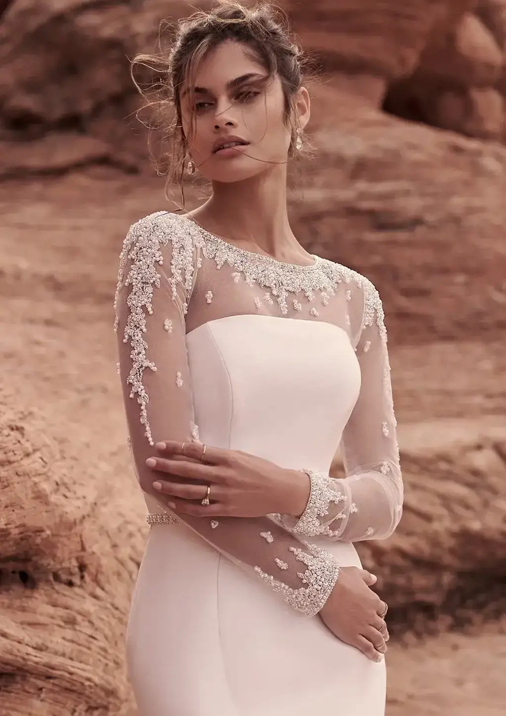 Model wearing white Maggie Sottero dress