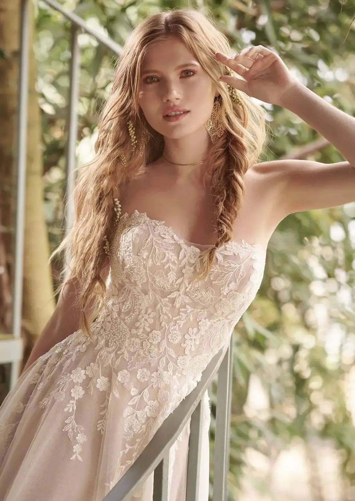 Model wearing white Maggie Sottero dress