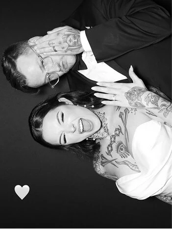 Сouple wearing a white gown and a black suit