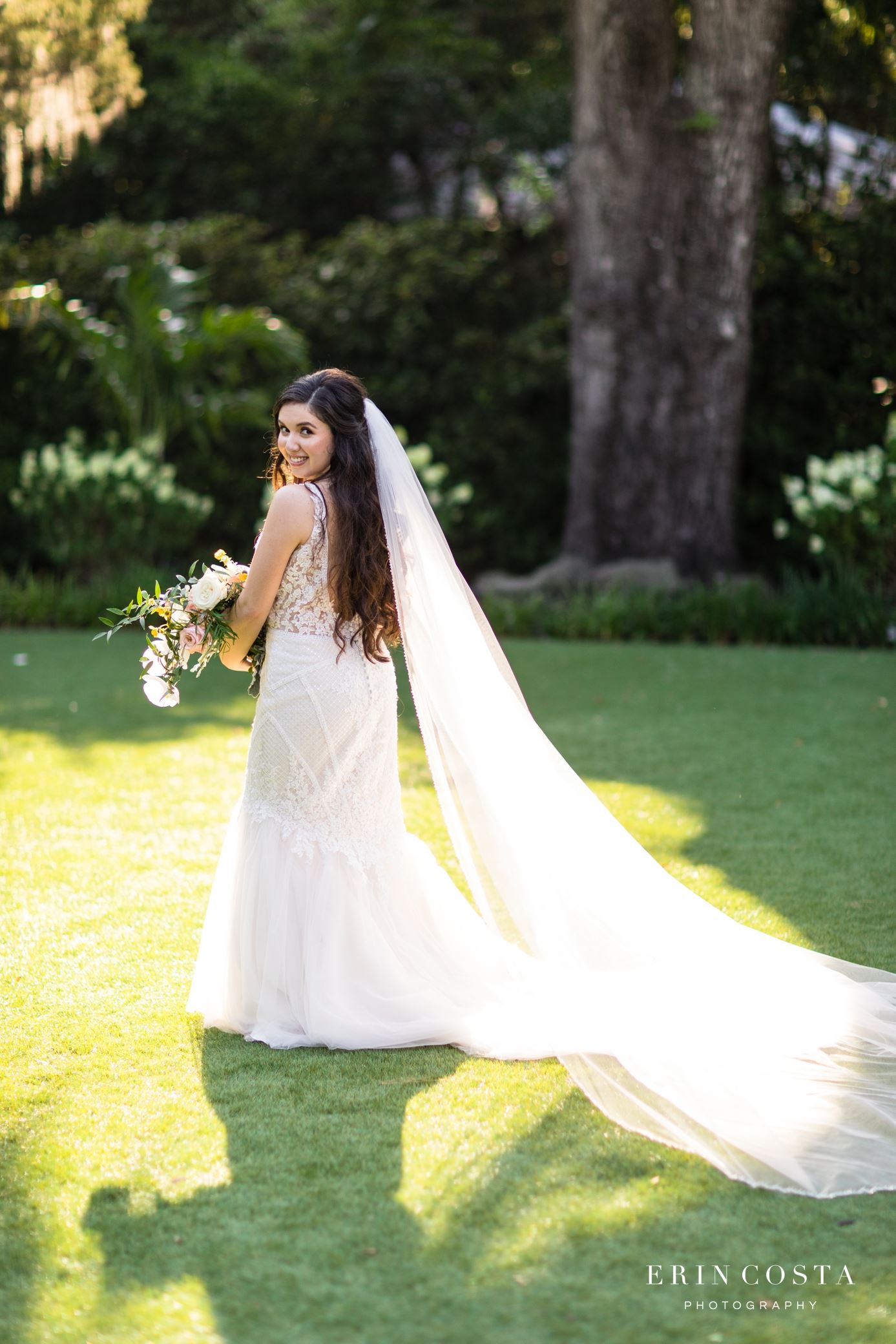 Model wearing a white gown on the grass