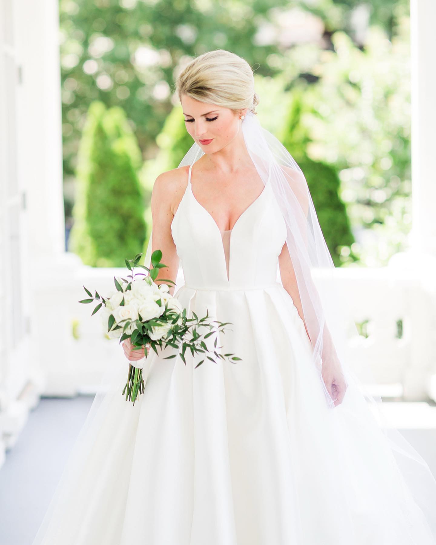Model wearing a white dress