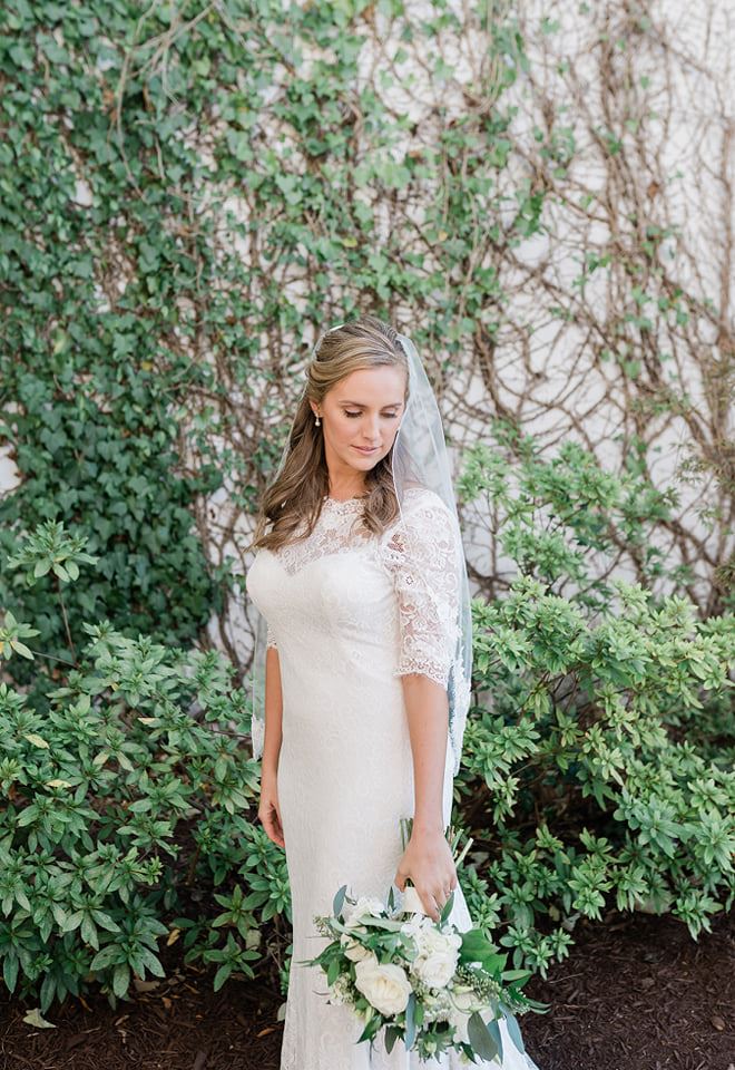Model wearing a bridal dress with a flowers