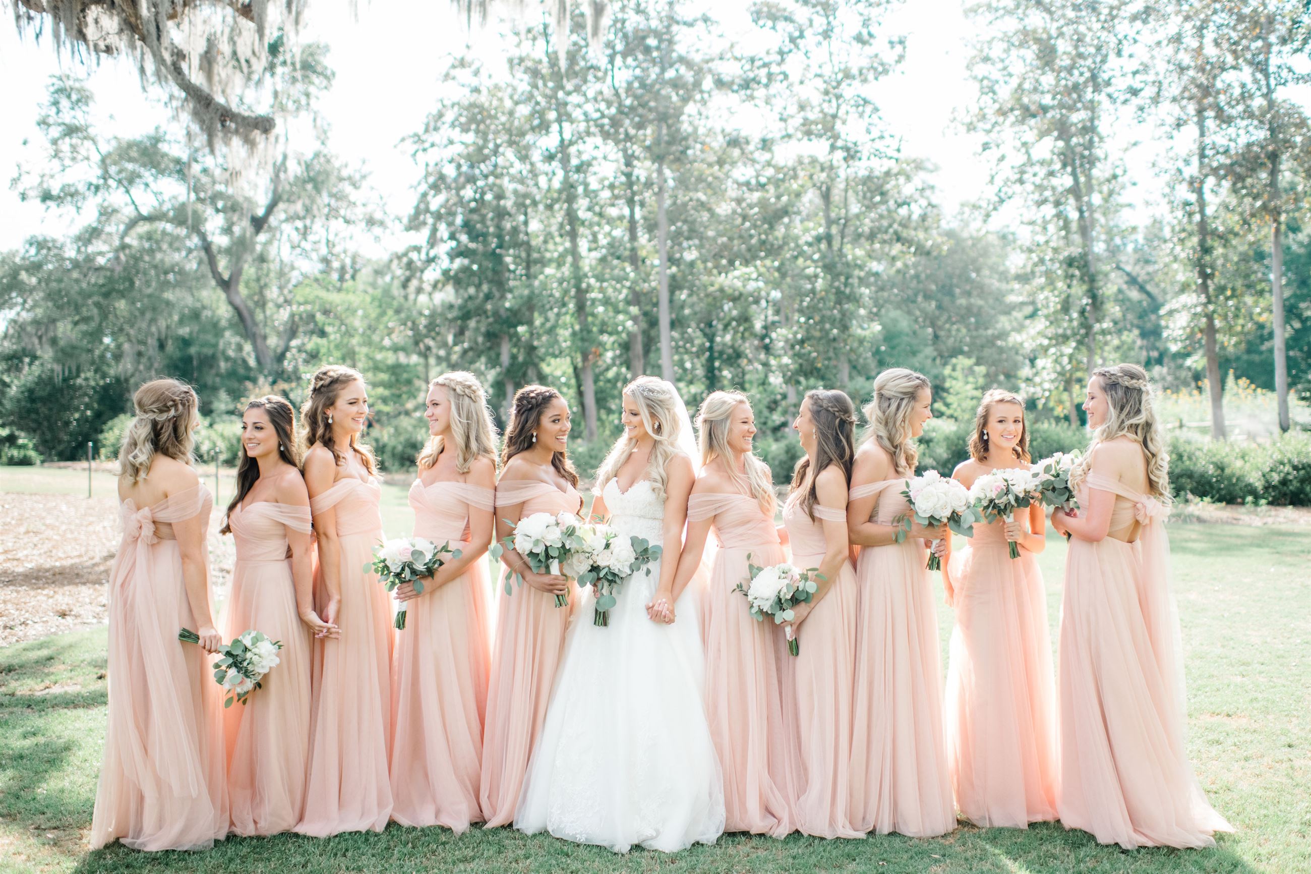 Models wearing a white gowns