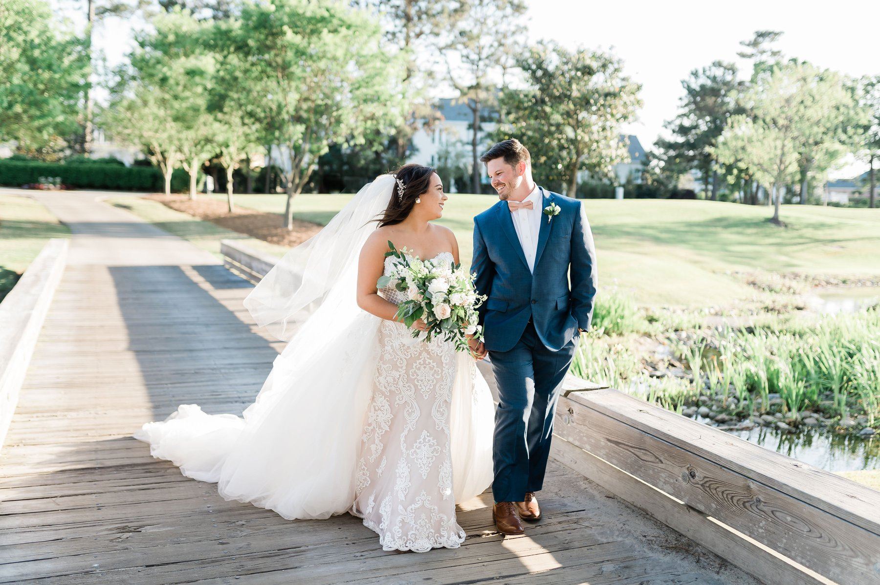 Сouple wearing a white gown and a black suit