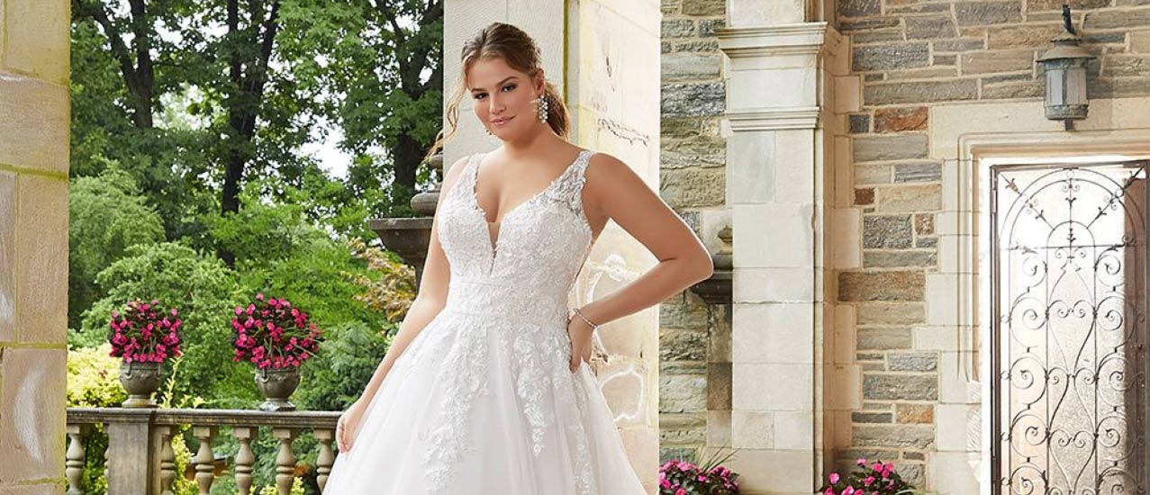 Woman with brown hair in plus size wedding gown
