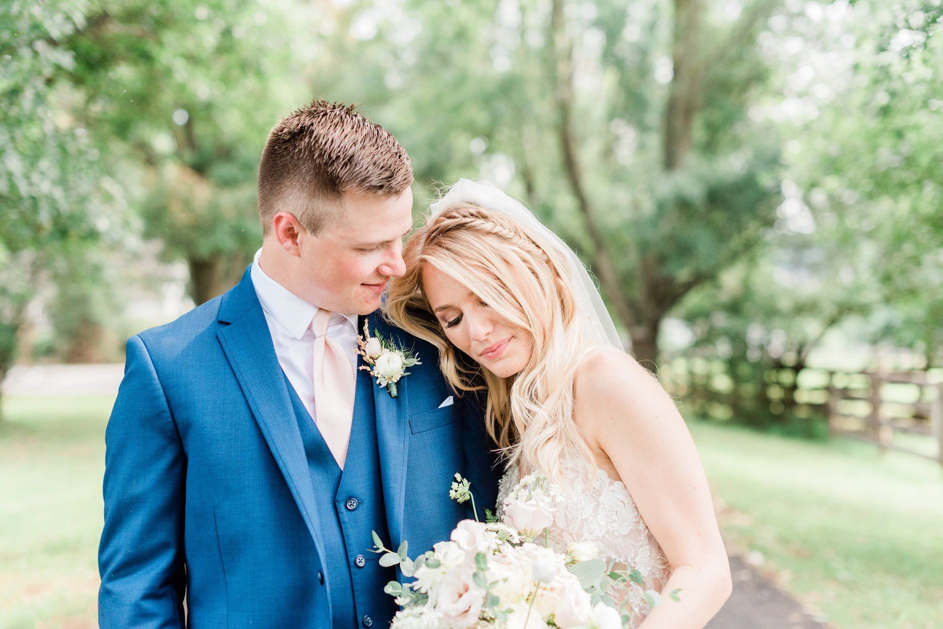 Сouple wearing a white gown and a blue suit