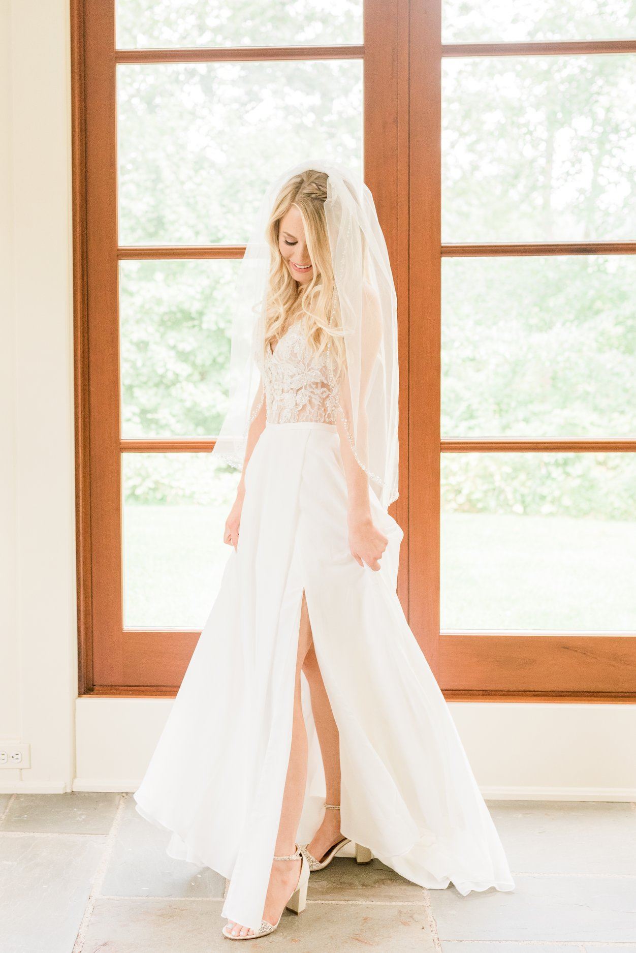 Model wearing a white gown at home